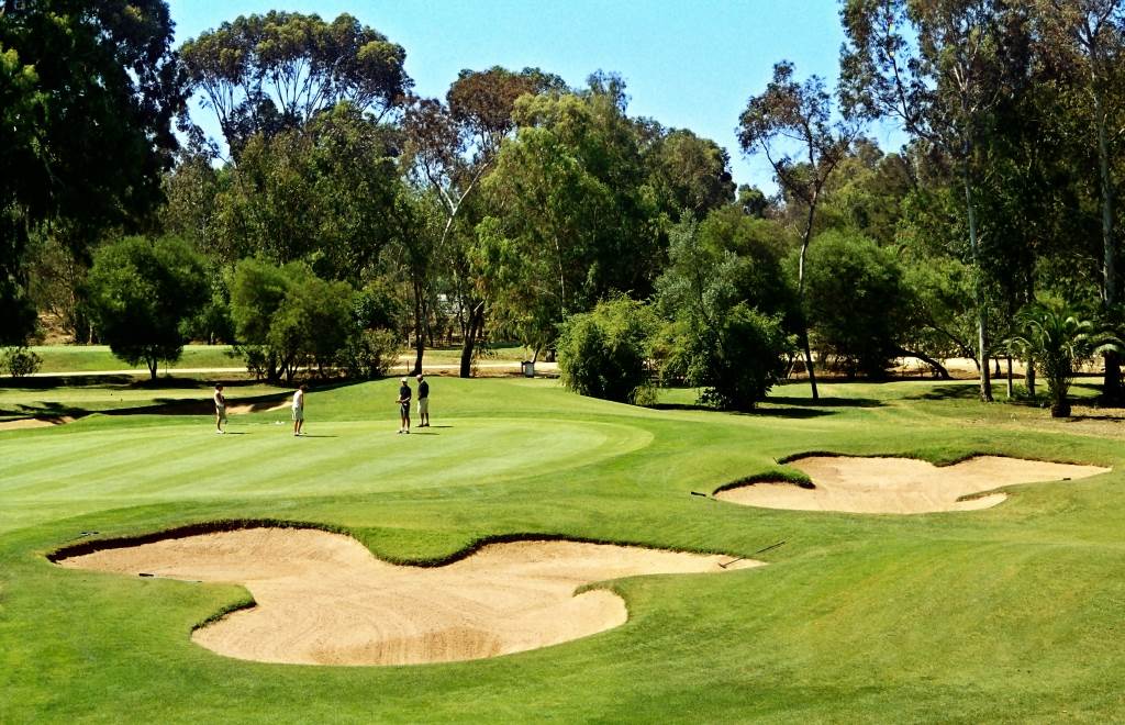 Golfers on the Sir Henry Cotton Championship Course at Penina Hotel and Golf Resort